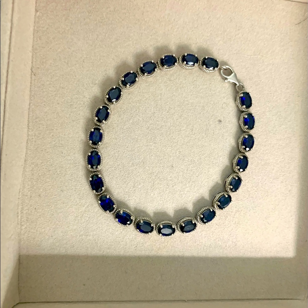 8.5” Sapphire tennis bracelet. It is so sparkly and beautiful on.